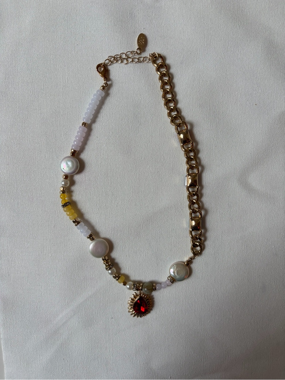 Gold Tone Beaded Necklace with White Pearls and Red Sunburst Pendant